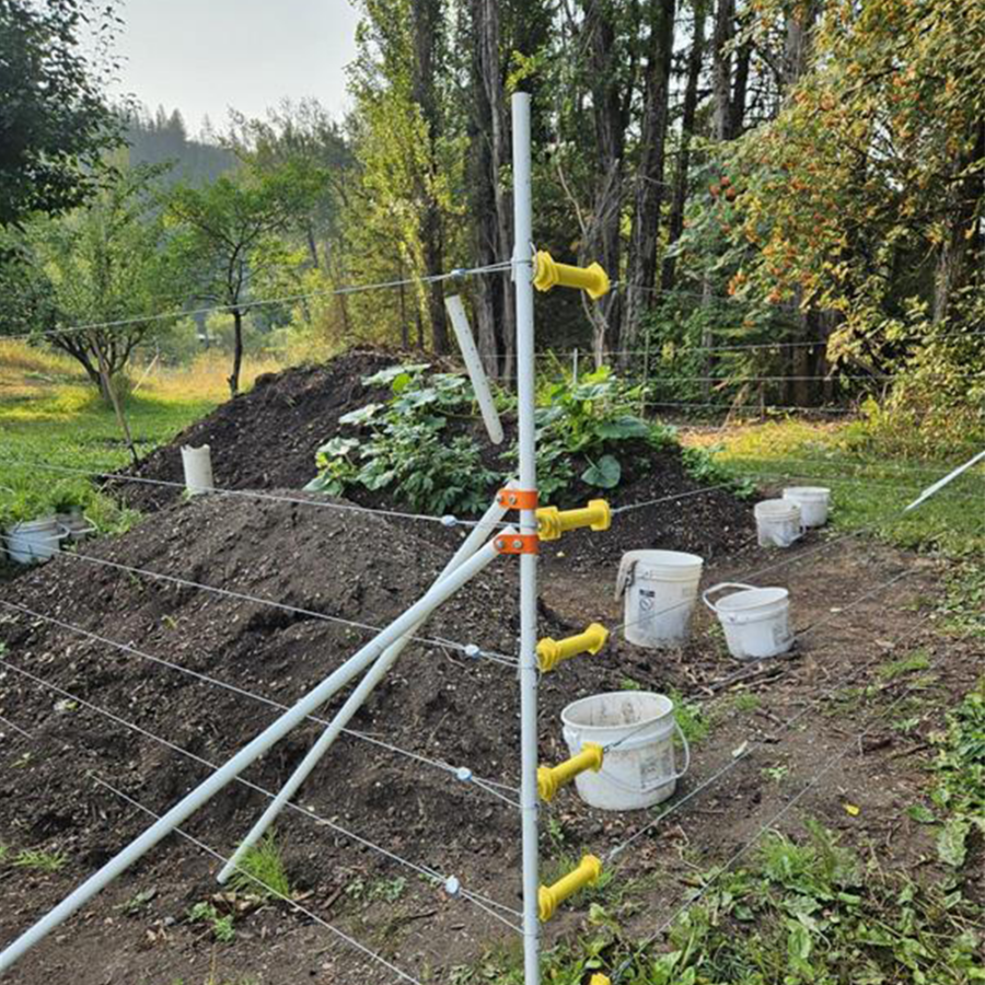 Double brace 7/8" Heavy-Duty Corner Assembly providing structural support for a portable electric fence gate opening.